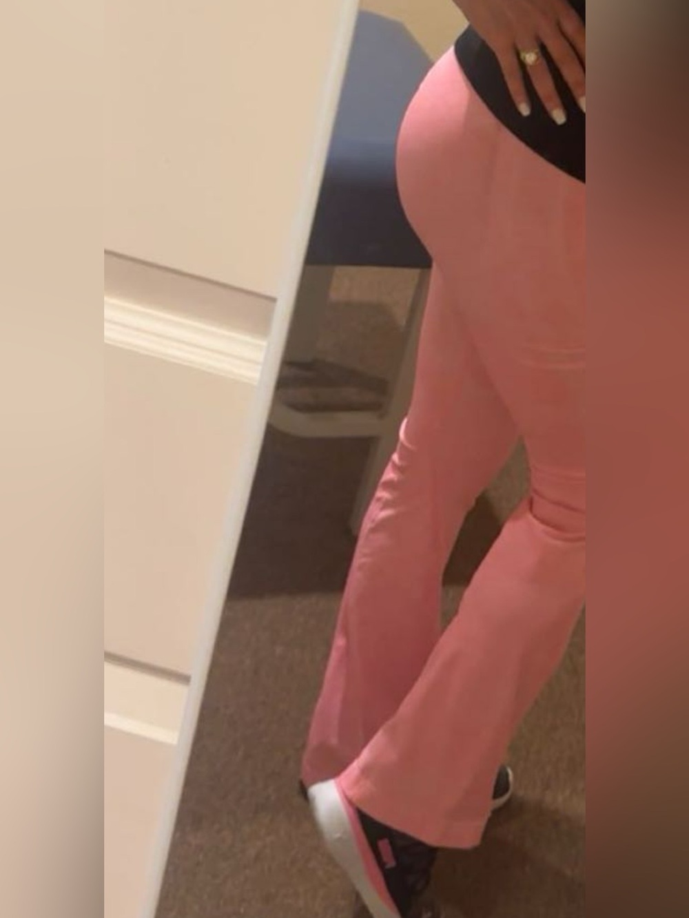 Hot pink athletic outfit with Puma sneakers